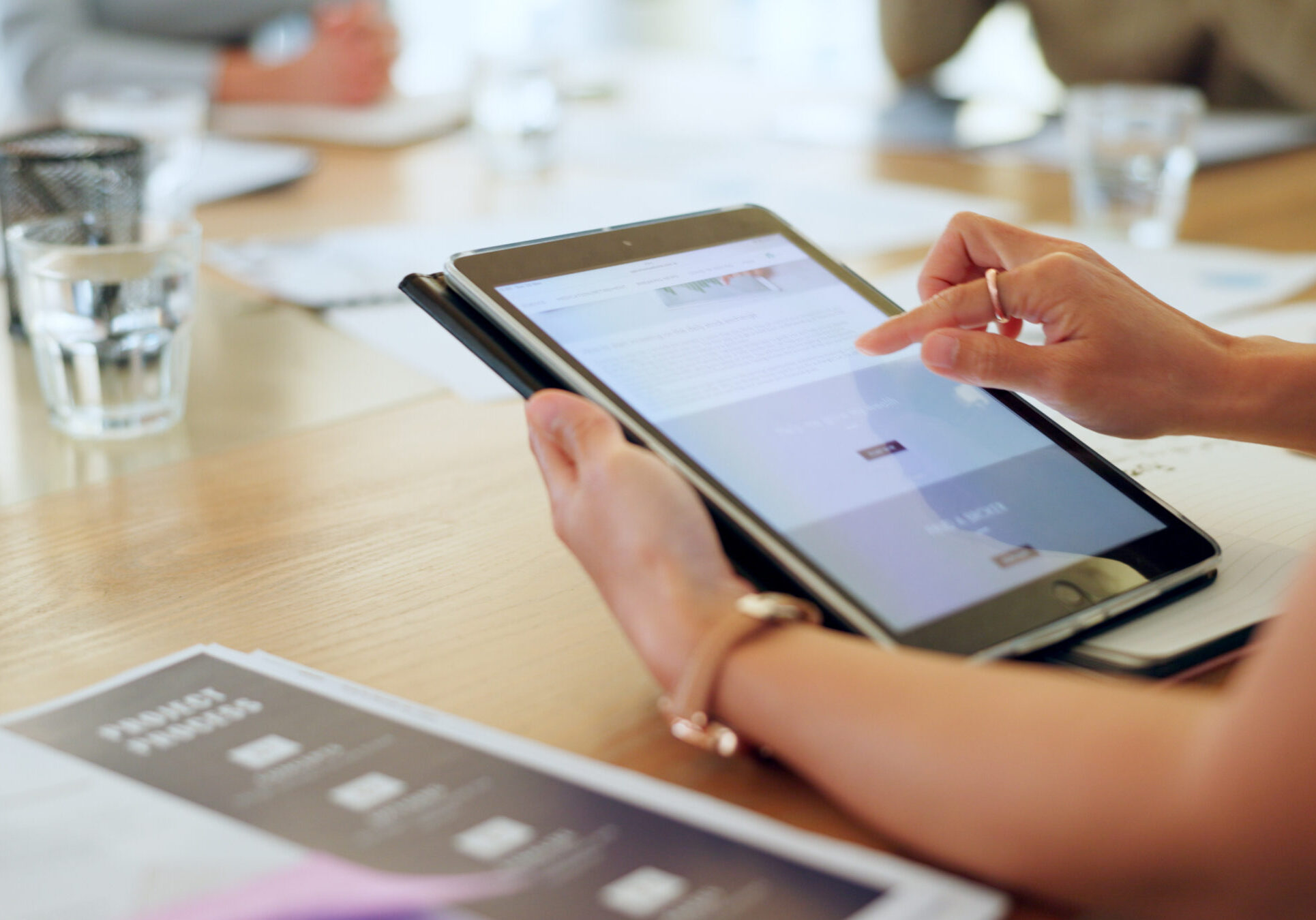 Business hands, screen and tablet for meeting, project proposal and website launch and software review. Professional person scroll on digital technology of ui or ux design feedback, FAQ or newsletter.